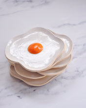 Carica l'immagine nel visualizzatore di Gallery, Stack of handmade stoneware Egg Spoon Rest designed to resemble a fried egg, perfect for kitchen use.