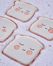 Load image into Gallery viewer, Mr Bready Spoon Rest featuring handmade stoneware design with smiley face, perfect for adding charm to your kitchen.