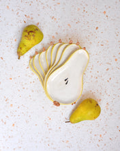 Load image into Gallery viewer, Handmade Pear Spoon Rest with multiple layers and yellow accents, alongside fresh pears on a textured surface.