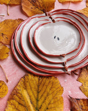Load image into Gallery viewer, Apple Plates - Set of 5, handmade stoneware plates with a fun apple design, surrounded by autumn leaves.
