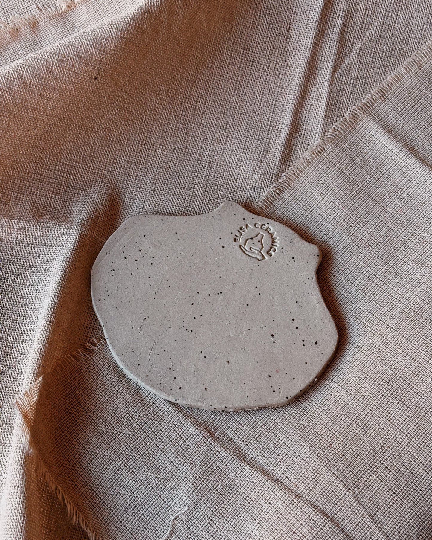 The back of a trinket dish with the shape of a shell