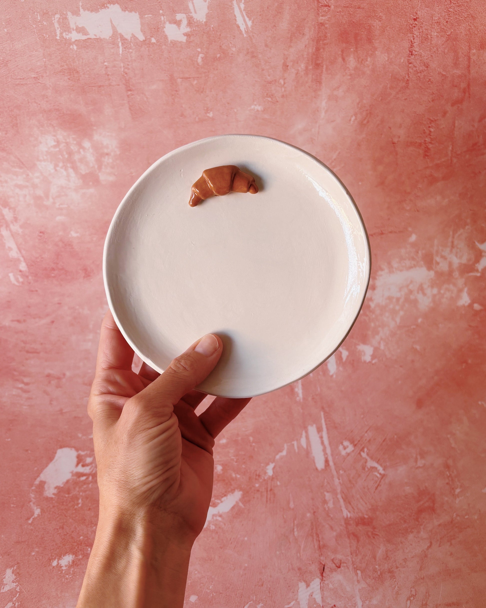 Croissant Small Ceramic Plate held in hand with a croissant on it, ideal for breakfast, handmade stoneware.