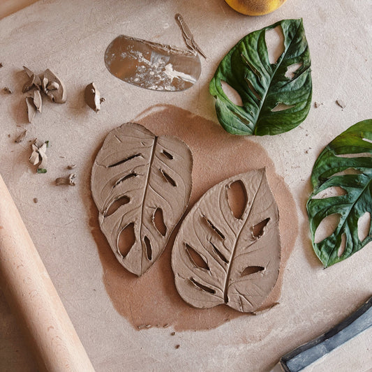 Ceramic leaves featuring real leaves used to make the leaf print
