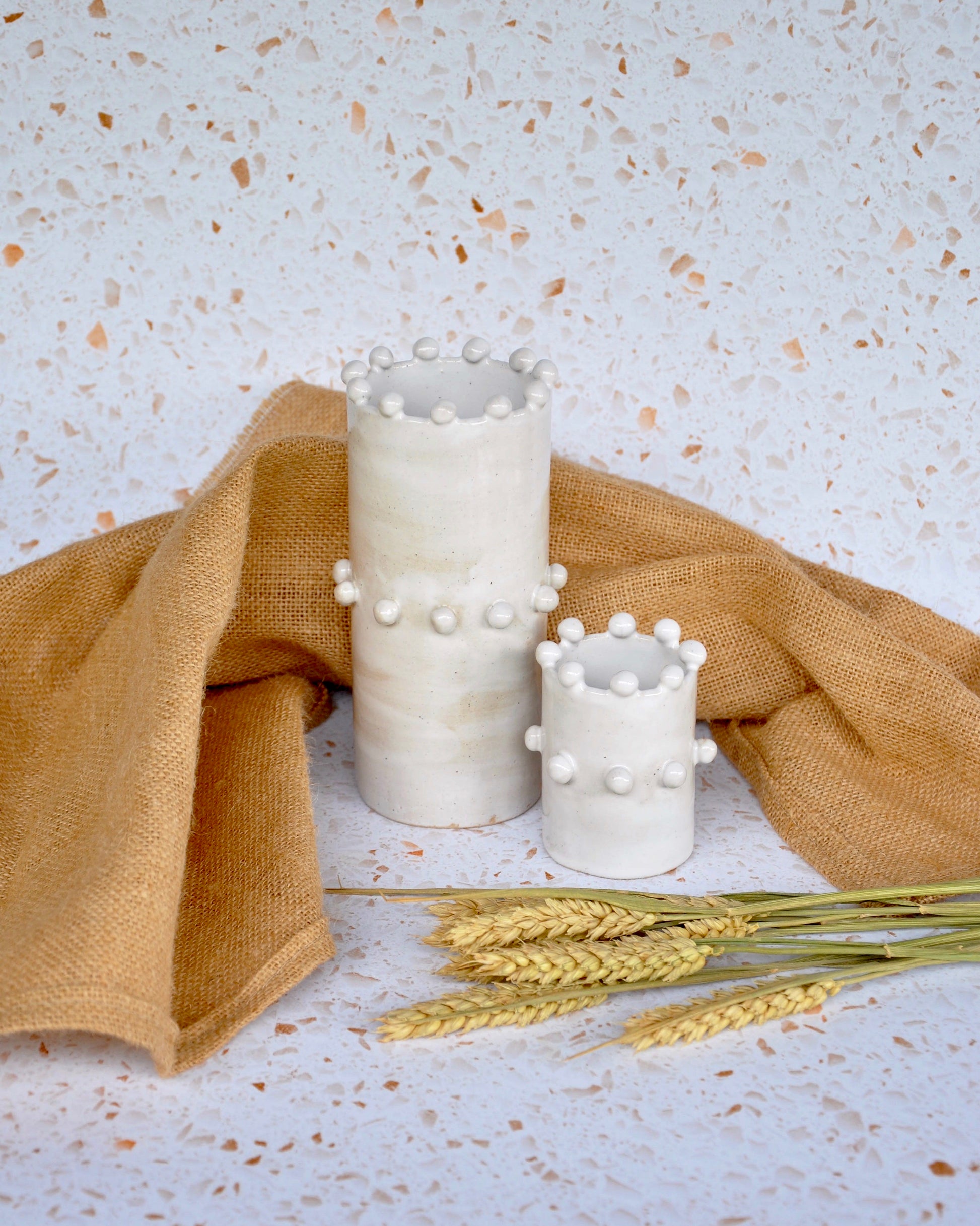 Chess Vase Set featuring handmade stoneware vases with unique designs, perfect for fresh flowers.