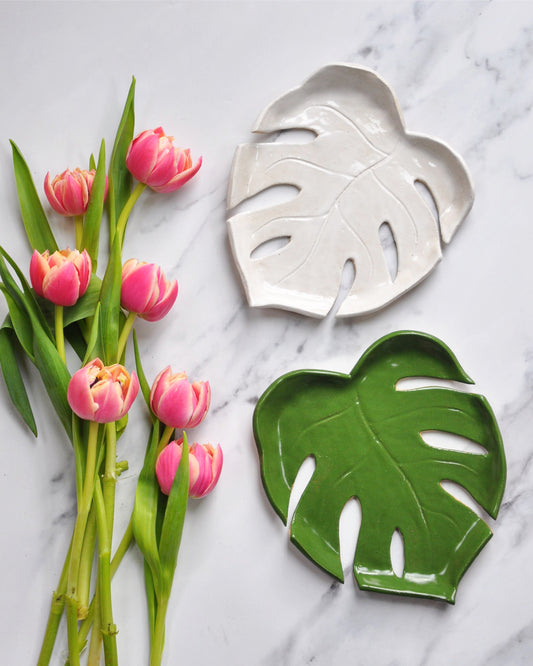 Monstera Leaf Plate set with pink tulips on a marble surface, showcasing handmade stoneware design.